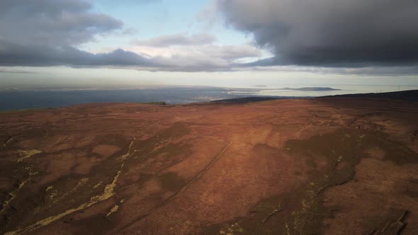 Distant View Of Dublin City From Wicklow Mountains In Ireland On A Cloudy Weather - ascending drone