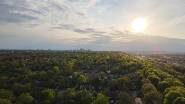 Flight on the Drone Side of the Big City at Sunset