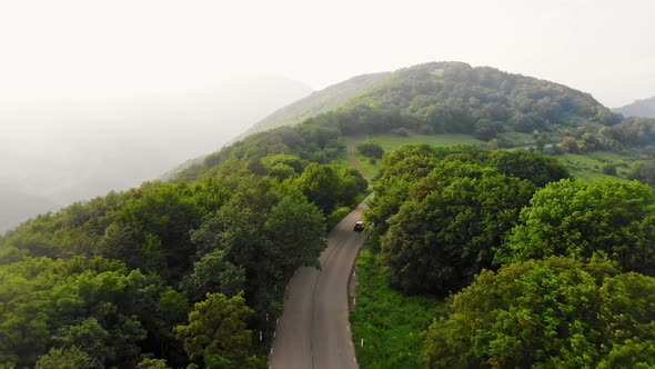 Black Automobile Drive In Caucasus Mountains