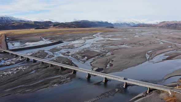 Drone Following Car Crossing Bridge Over Hvannagil Estuary