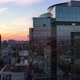 Reflection of the city in the windows of a glass building in the city center - VideoHive Item for Sale