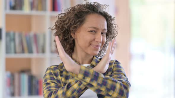 Portrait of Mixed Race Woman No Gesture By Crossed Arms