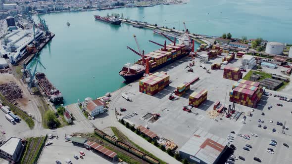 Aerial top view of cargo ship standing in the port