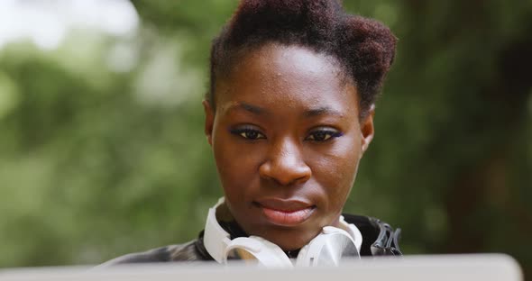 Woman with Laptop in the Park alt