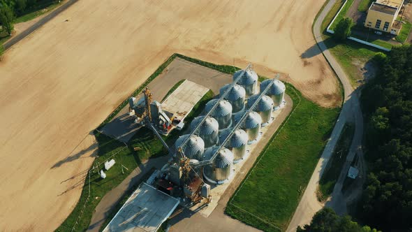 Aerial Elevated Top View Modern Granary Graindrying Complex Commercial Grain Or Seed Silos In Sunny