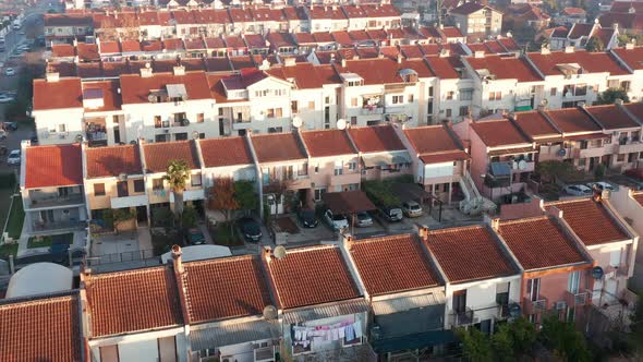 Rows of terrace houses in a mill town. Townhouses with red roofs in a company village or monotown