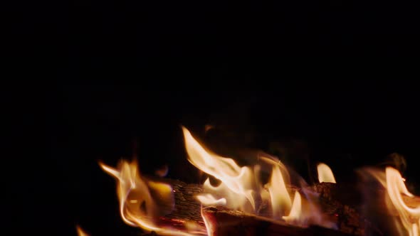 Fire burns in the night, slow motion 250p