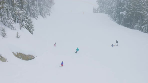 Aerial View From the Chairlift of People Skiing