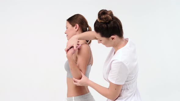 A Modern rehabilitation physiotherapy worker with woman client. chiropractor massaging