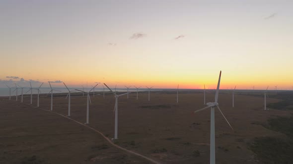 Aerial View of Big Field with Wind Turbines Rotating and Generating Energy