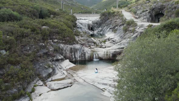 Aerial pullback revealing breathtaking 7 lagoons trail, natural pure water pools, Gerês