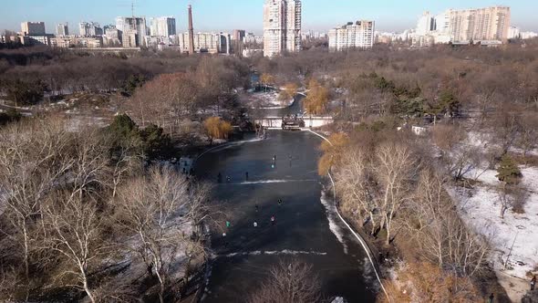 Aerial View on Winter Park with Frozen Lakes, Walking People