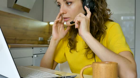 Young Woman is Having Online Meeting Using Her Laptop Businesswoman with Digital Tablet Sitting on