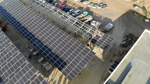 Aerial View Panorama of Solar Panels. Slow Movement of the Camera Over the Panels. Background