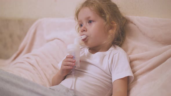 Little Girl Has Procedure with Inhaler to Cure Cough in Room