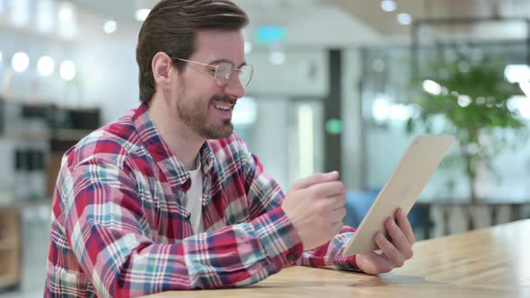 Professional Male Designer Doing Video Call on Tablet