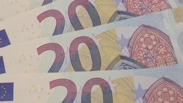 Euros twenty denomination on table money and business background 4K 2160p 30fps UltraHD tilting foot