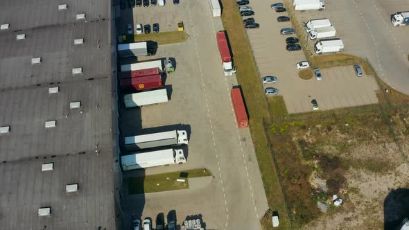 Logistics Park with Warehouses and Trucks a Loading Hub and Many Semitrailers