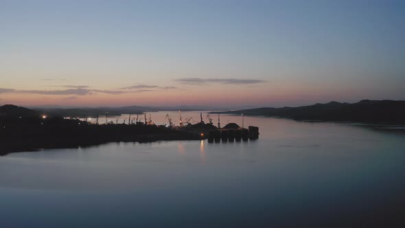 Cargo Cranes Working Early in the Morning at Dawn