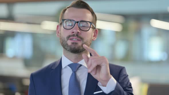 Portrait of Online Video Call By Middle Aged Businessman