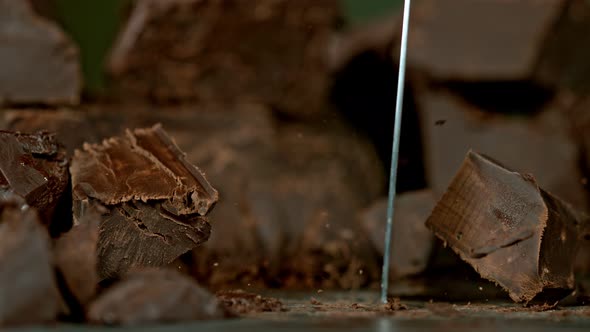 Super Slow Motion Shot of Cutting Raw Chocolate Chunk at 1000 Fps