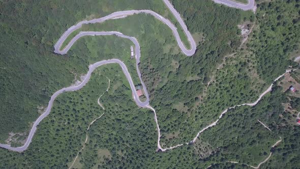 Aerial view of a winding mountain road in Italy