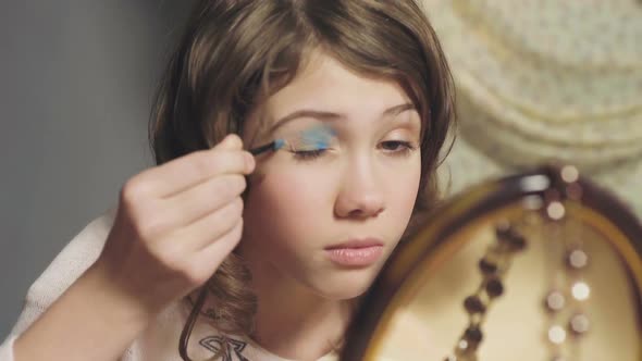 Female Child Clumsily Using Sisters Eye Shadow, Wants to Look Like Adult