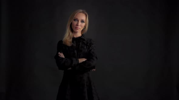 Dark Portrait on Black Blonde Woman in Black Dress