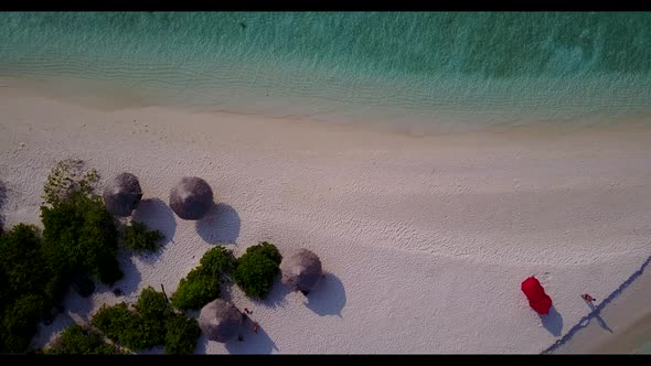 Aerial top down texture of paradise tourist beach voyage by aqua blue ocean and white sand backgroun