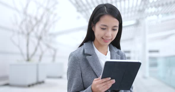 Businesswoman work on tablet computer in Hong Kong 