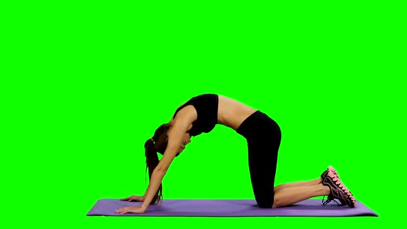 Young Woman Practicing Yoga in Gym, Green Screen