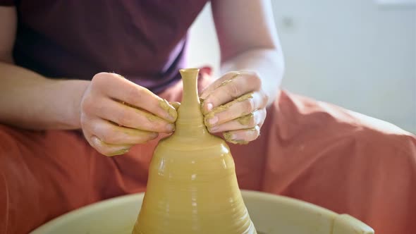 Experienced Potter Creating a Clay Vase Using Professional Tools