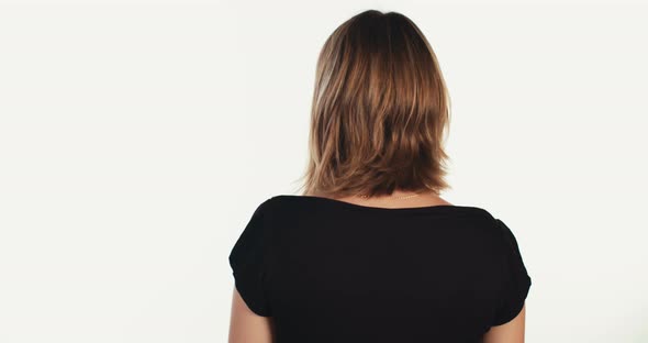 Young beautiful blonde woman making happy expressions on white background