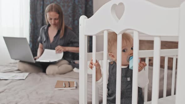 Toddler in Crib when Mother Working