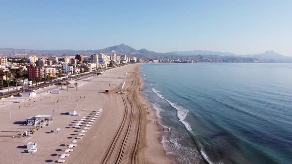 Aerial overview of beach and coastal town in the Mediterranean. Playa de Muchavista, El Campello, Sp