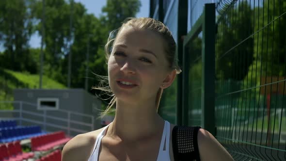 Attractive Caucasian Female in Sportswear at Sports Ground Ready for Work Out