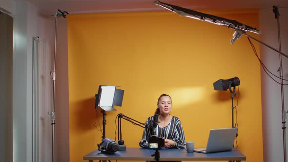 Influencer in Her Studio Recording a New Episode