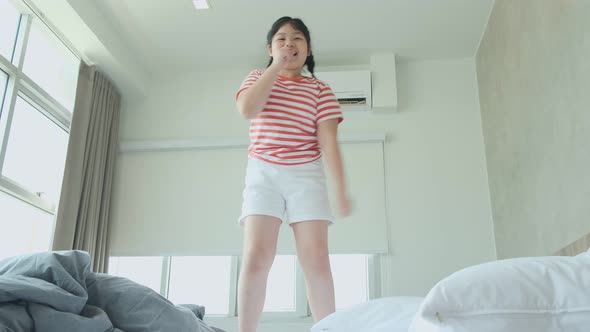 asian female casual cloth dance jump and singing with cheerful and happiness