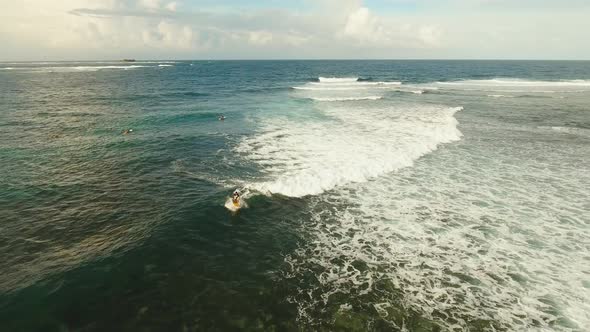 Surfers on the Water Surface