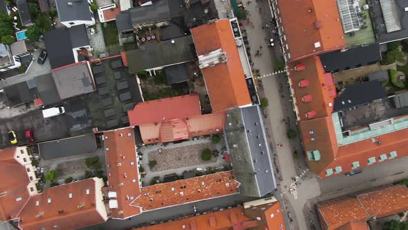 Red colorful rooftops of Ystad city with narrow streets, aerial top down view