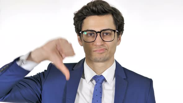 Thumbs Down by Young Businessman Isolated on White Background