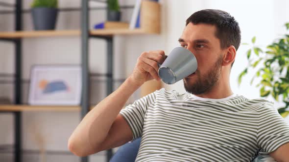 Portrait of Happy Man Drinking Coffee at Home