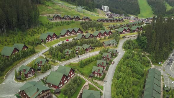 Wooden cottages in the ski resort Bukovel, Ukraine. Summer holidays in the Carpathian mountains