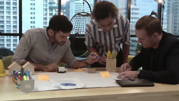 Creative Business People Group Having Conversation at Office Desk in Workplace