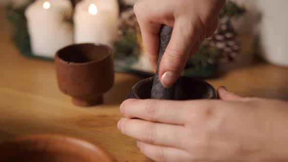 The Top View of a Pestle Spices Peppers and Sea Salt in the Grey Stone Mortar