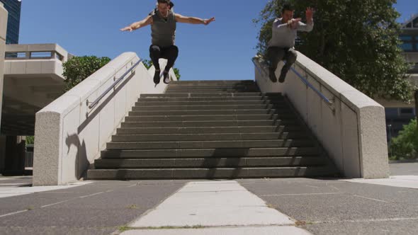 Caucasian men practicing parkour