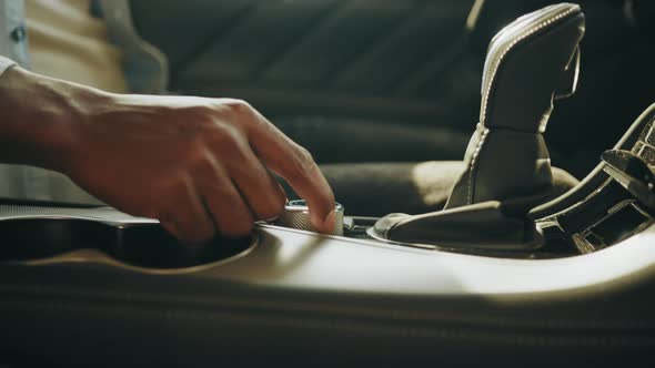 Man's Hand Presses Electronics Control Buttons