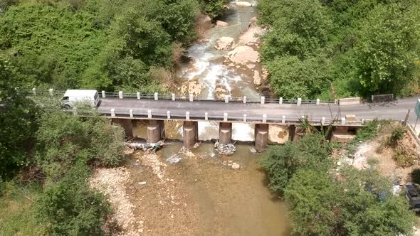 Aerial Shot Of Cars Crossing Historical Bridge Of Zbeideh Village, Lebanon