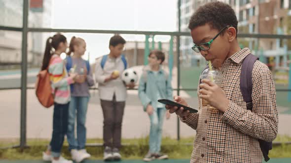 School Boys with Smartphone at Playground
