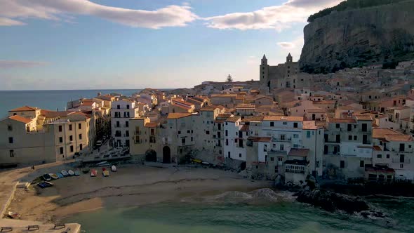Cefalu Sicily Sunset at the Beach of Cefalu Sicilia Italy Mid Age Men and Woman on Vacation Sicily